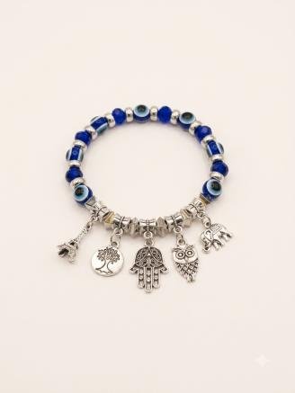 Handmade blue evil eye bracelet featuring Hamsa hand, owl, elephant, tree of life, and Eiffel Tower charms.