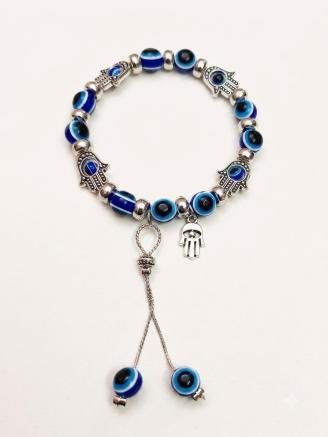 Handmade blue evil eye bracelet with silver Hamsa charms and decorative dangling bead accents.