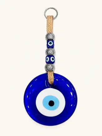 Handcrafted blue evil eye glass wall hanging with decorative beads and hanging cord