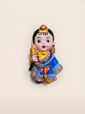 Handmade Tibetan boy monk fridge magnet with traditional Buddhist attire
