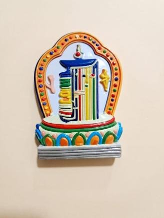 Handmade Tibetan Kalachakra fridge magnet with a colorful Buddhist design