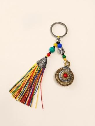Handmade Tibetan lucky charm tassel keychain with multicolor beads, vintage prayer wheel pendant, and decorative tassels for bags, keys, and car accessories.